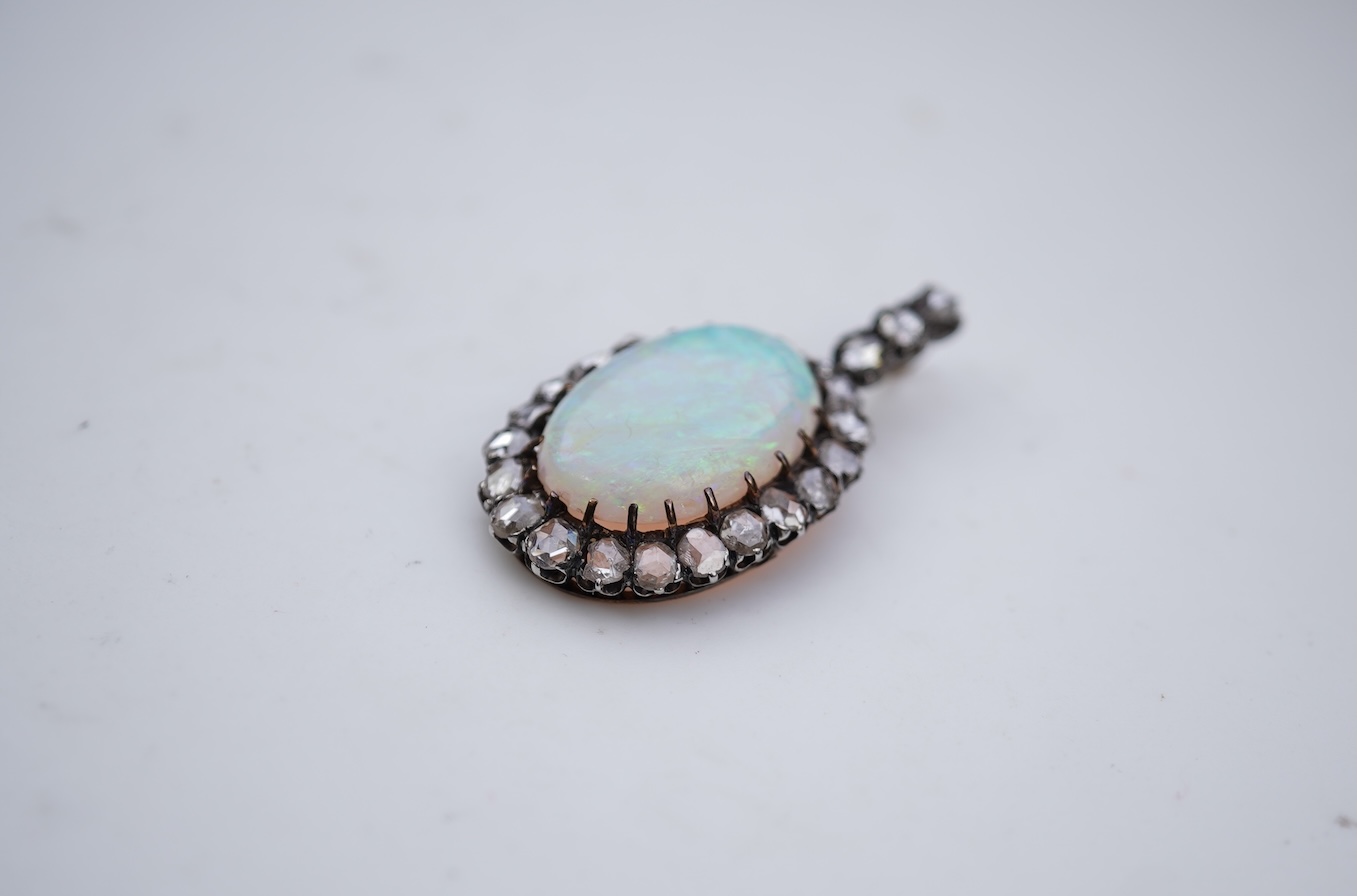 An opal and diamond pendant, early 20th century